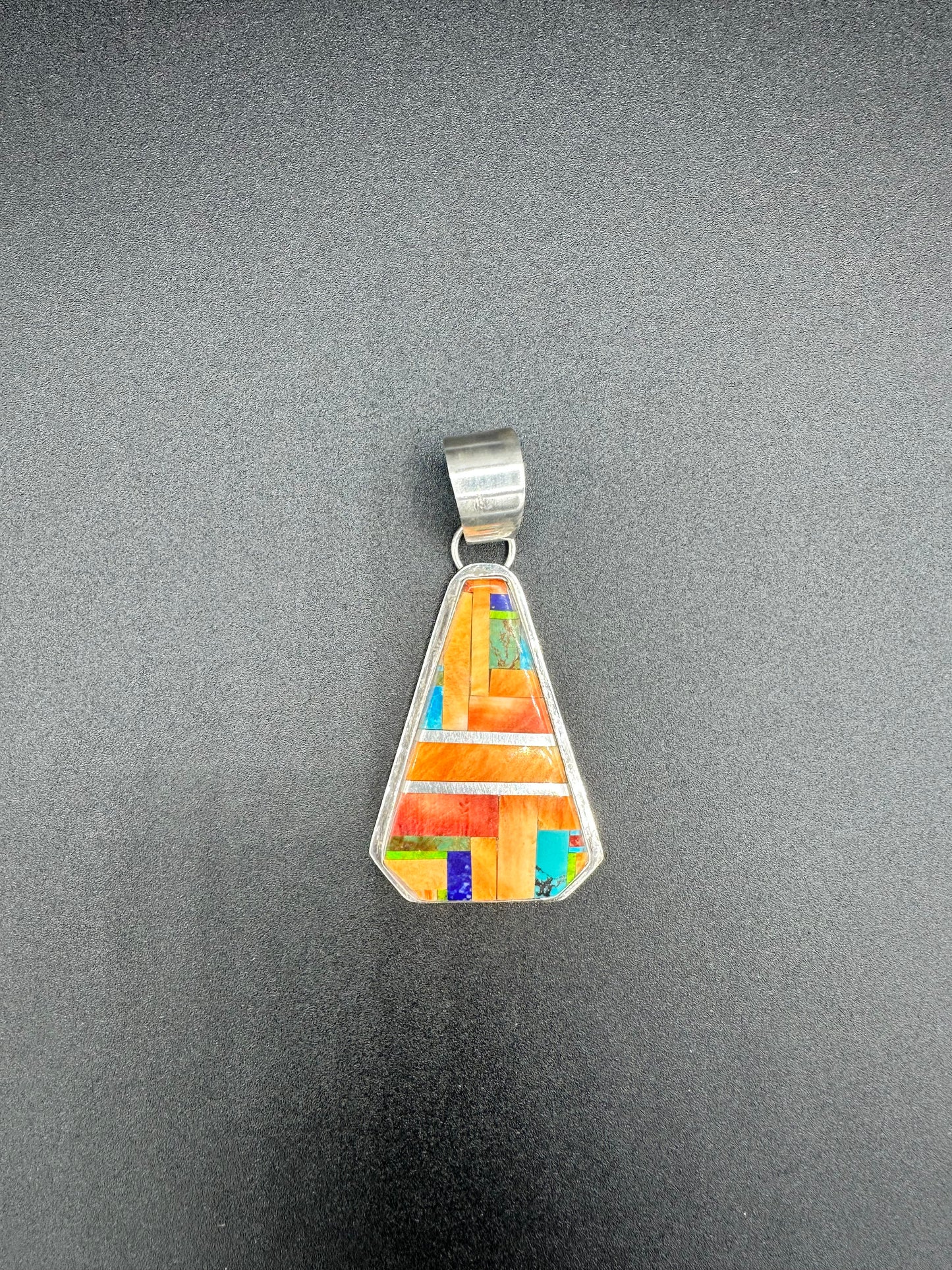 Handcrafted Native American sterling silver and multi-gemstone necklace and pendant.